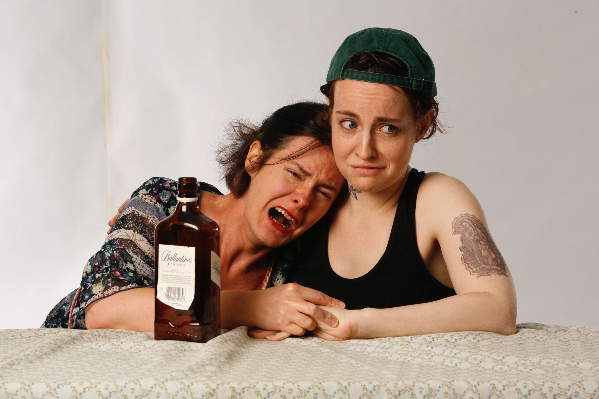 Two performers sharing an emotional comic moment in And Sophie Comes Too
