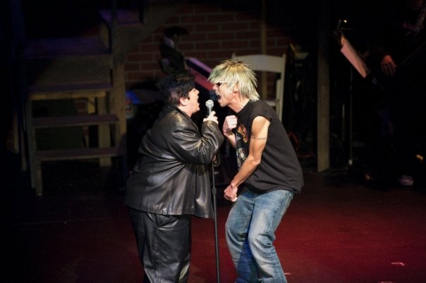 Lea DeLaria singing with another performer in Insatiable Hunger